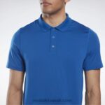 رجال ناقلات الأزرق قميص بولو جاهز للتمارين الرياضية Reebok 0NZ0F1256 - Image 4