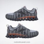 رمادي نقي 3 / رمادي نقي 7 / برتقالي سحق s23-r حذاء زيجويلد تريل 6 للرجال Reebok 0NZ0F1059 - Image 9